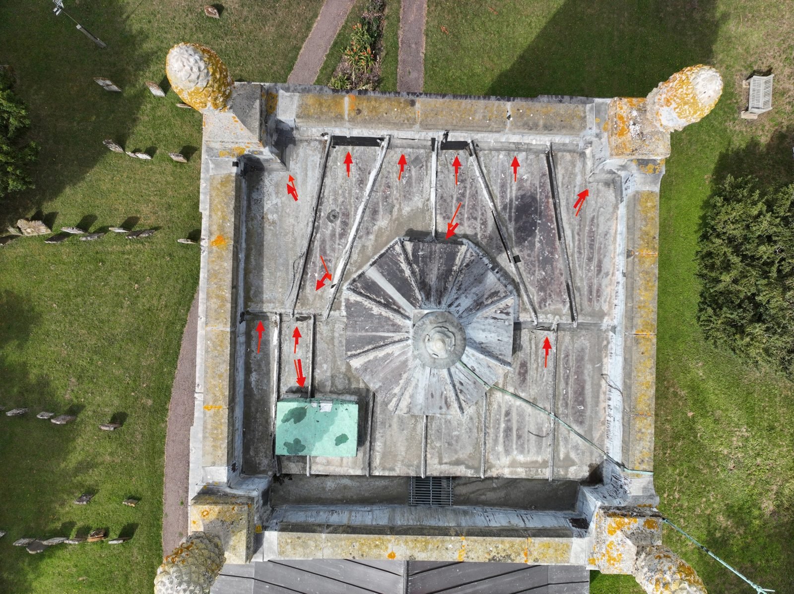 Annotated aerial photograph of the tower roof at St Mary Magdalene church, Willen, with red arrows marking locations flagged for close review